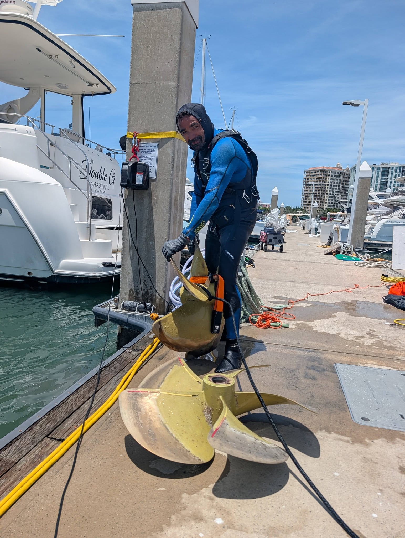 Bottom Time diver with propellers during a Sarasota marina service job
