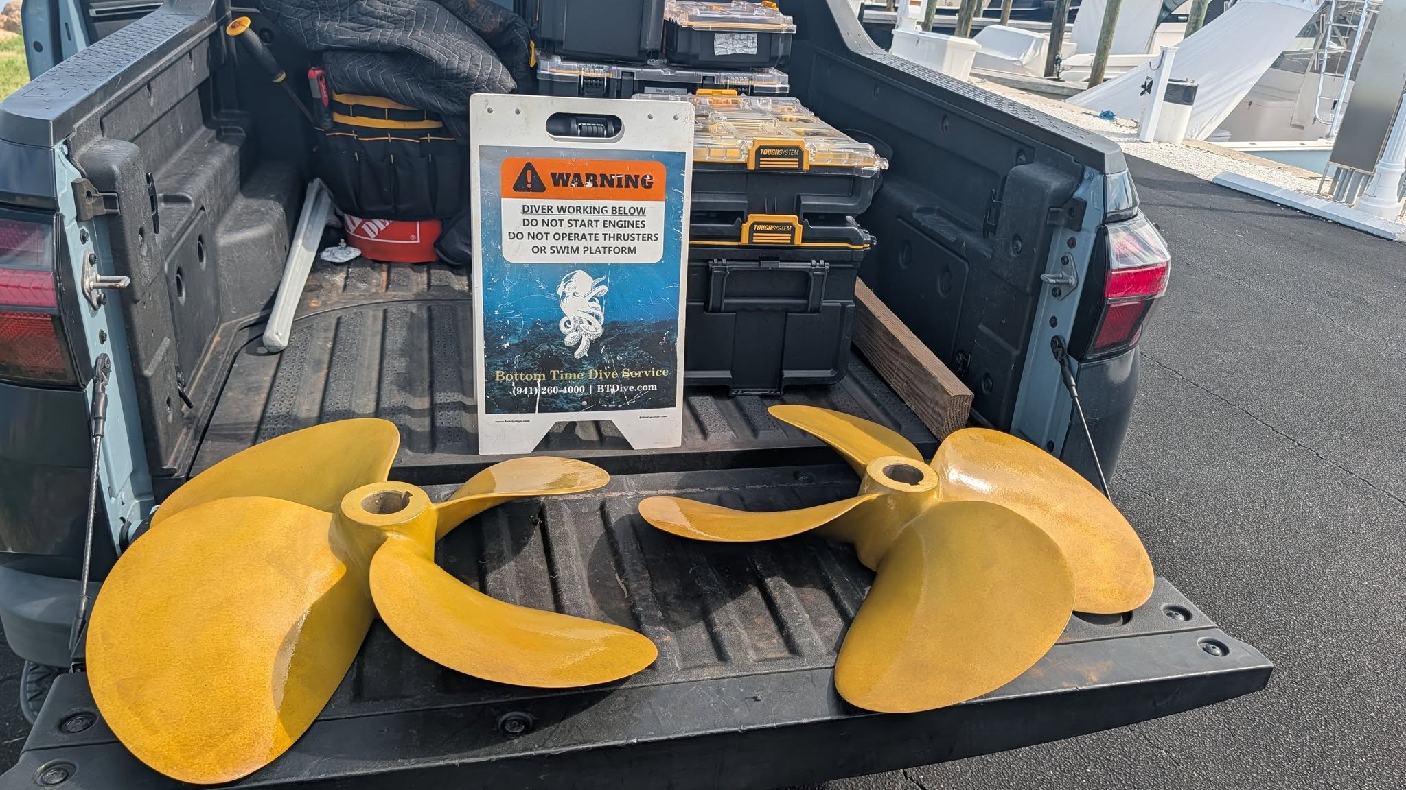 Bottom Time Dive Service propellers and equipment at a Venice marina